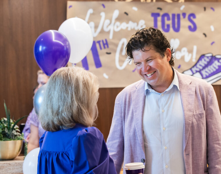 Chancellor Pullin greets faculty, staff and students in the lobby of The Harrison